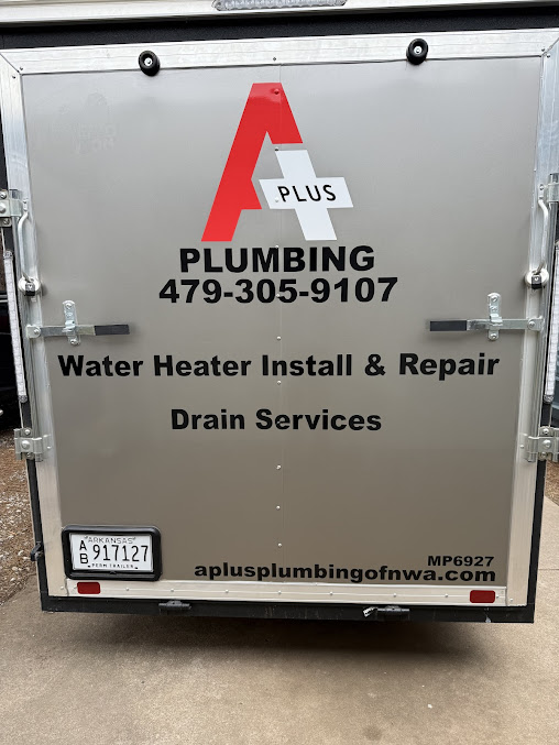 Back of a plumbing service vehicle with contact info and services listed.